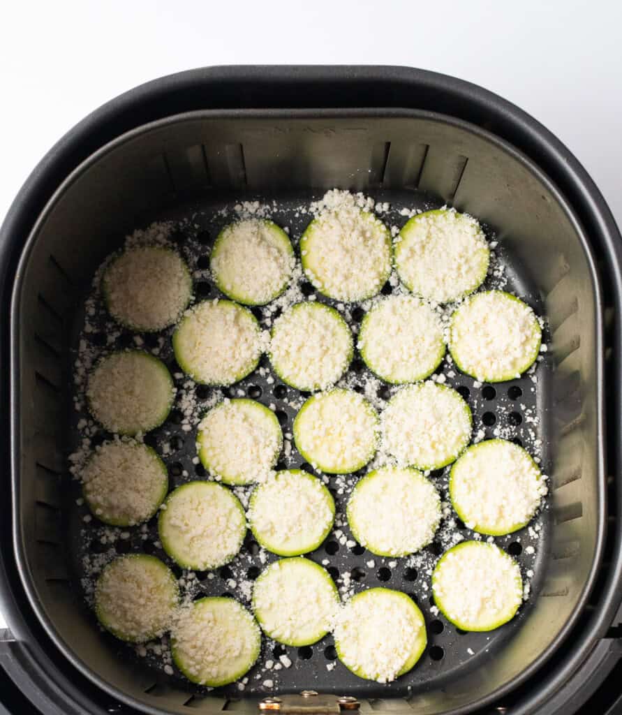 Zucchini chips with parmesan in air fryer basket