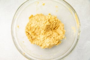 Churro dough in a glass bowl
