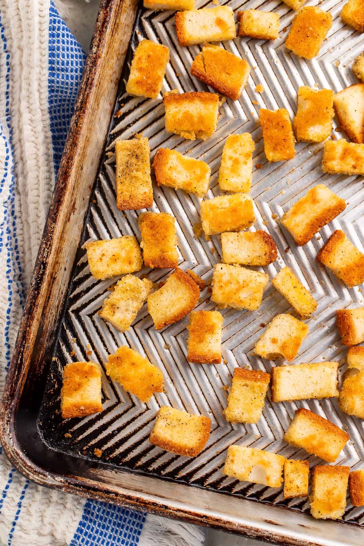Close up of croutons on a baking sheet.