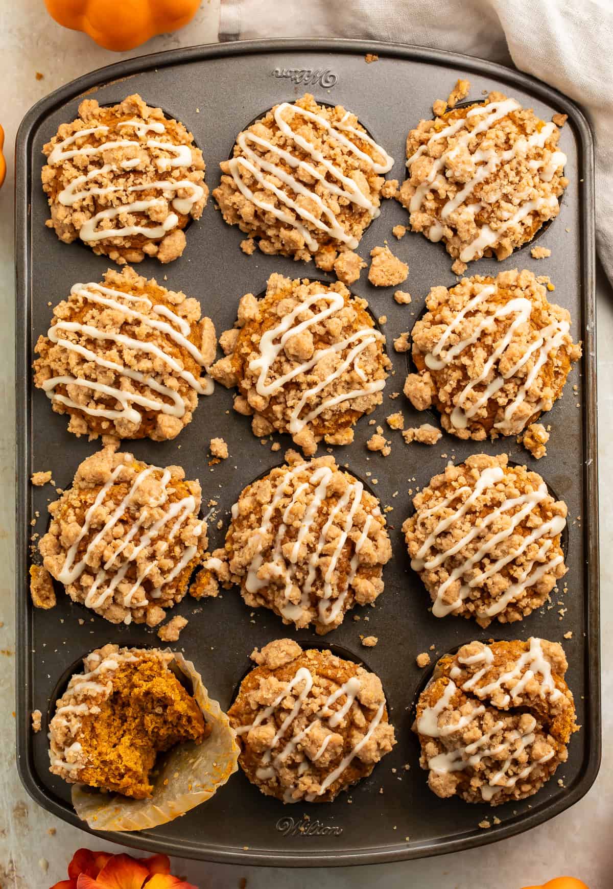 Top down view of gluten free pumpkin streusel muffins in the muffin pan.