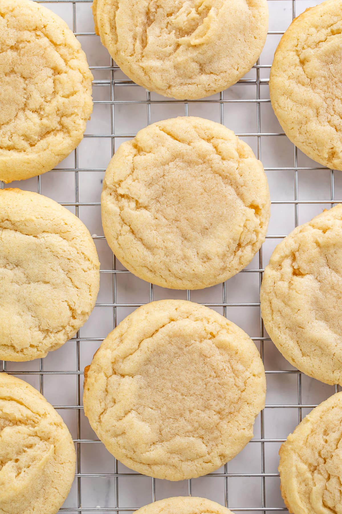 Vegan sugar cookies on a cooling rack.