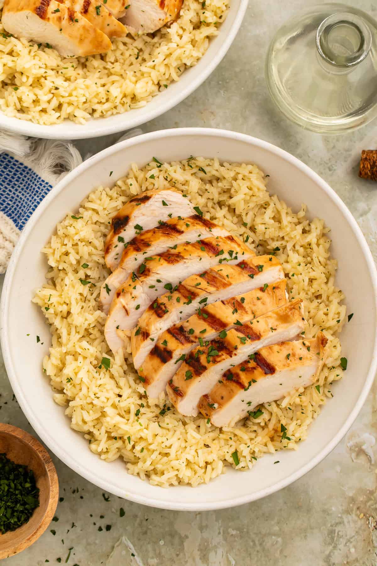 Healthy grilled chicken and rice bowl with sliced chicken breast and seasoned rice