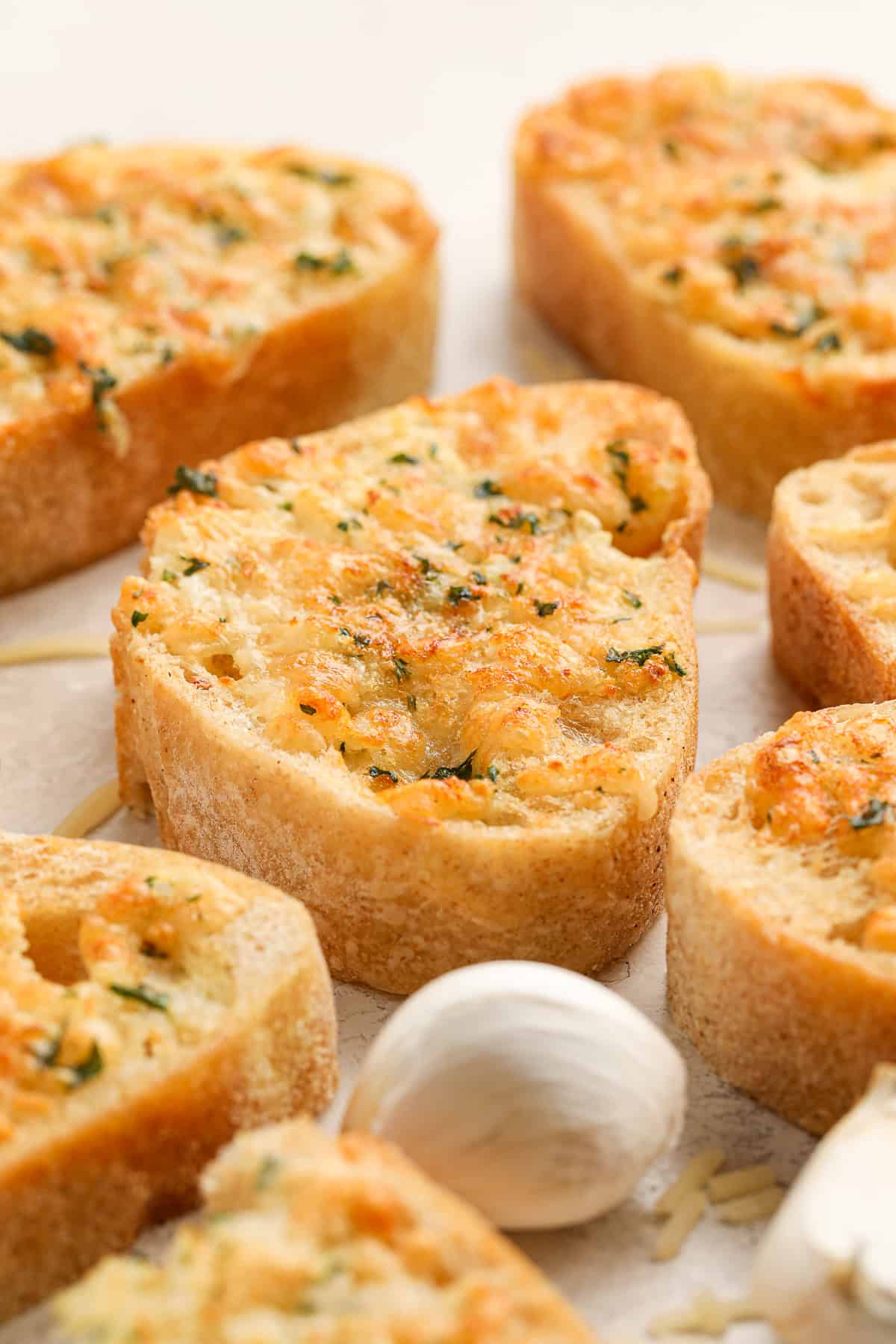 Cheesy air fryer garlic bread slices topped with garlic and parsley