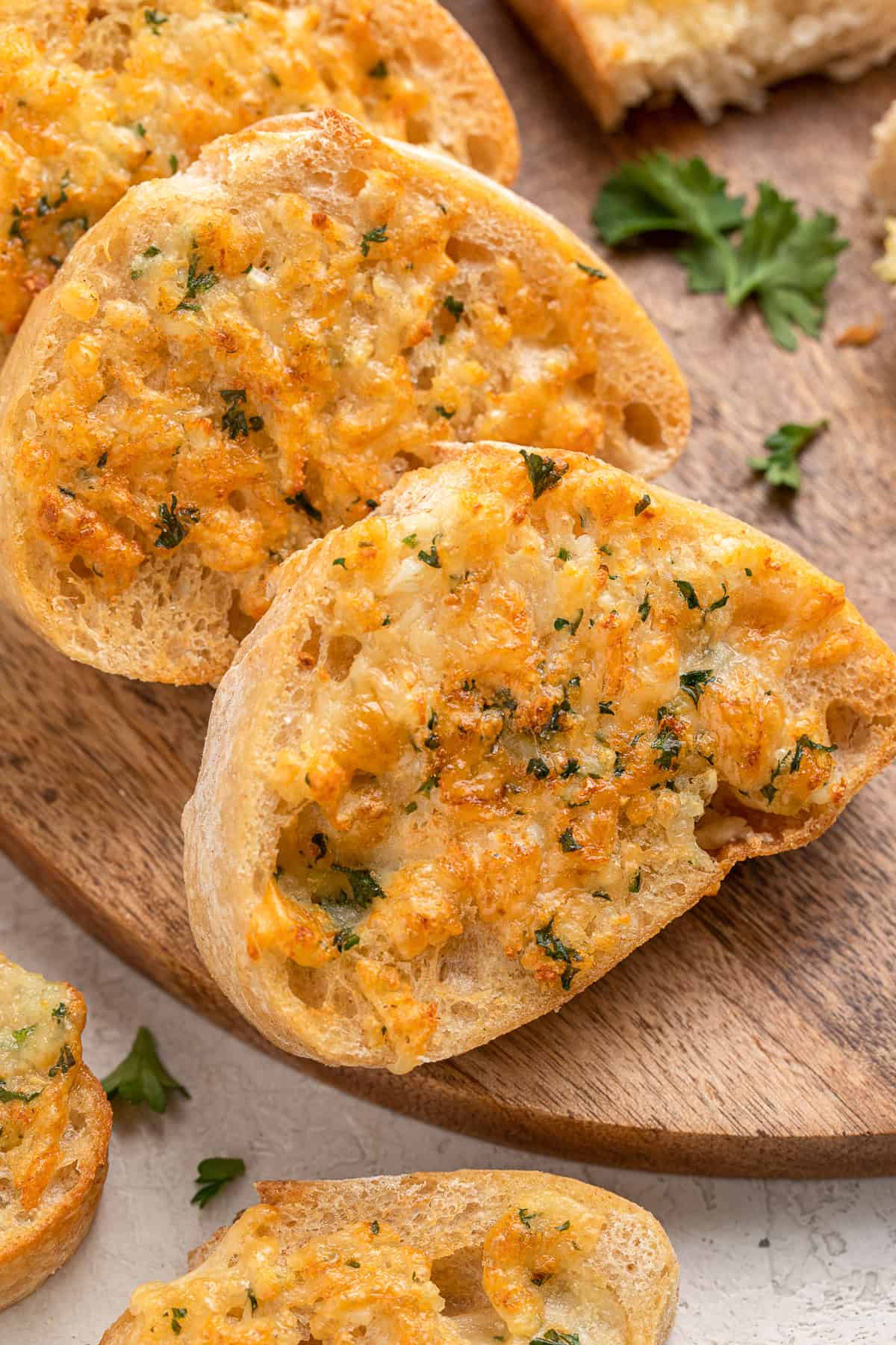 Crispy air fryer garlic toast with melted cheese and fresh parsley