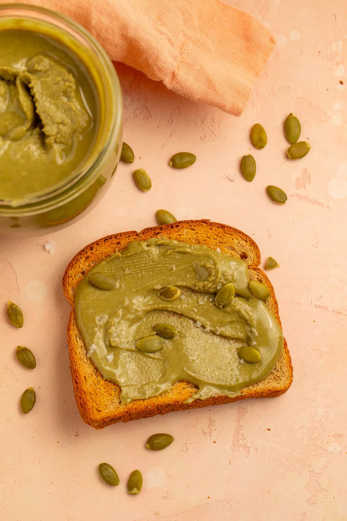 Toast with creamy pumpkin seed butter, pepitas, and flaky salt