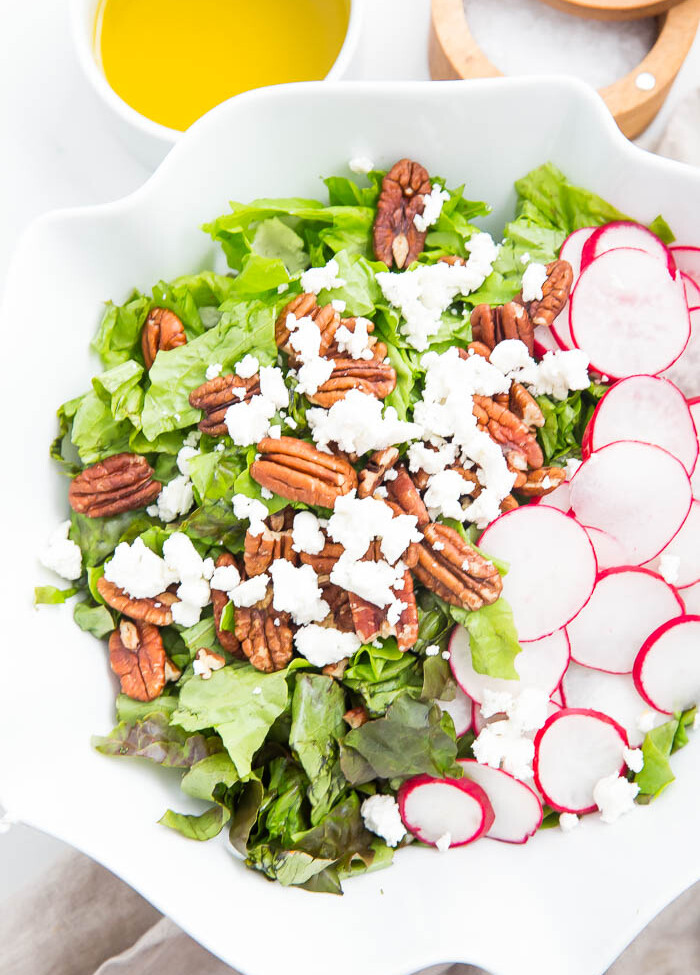 colorful image of salad in white bowl with apple cider vinaigrette