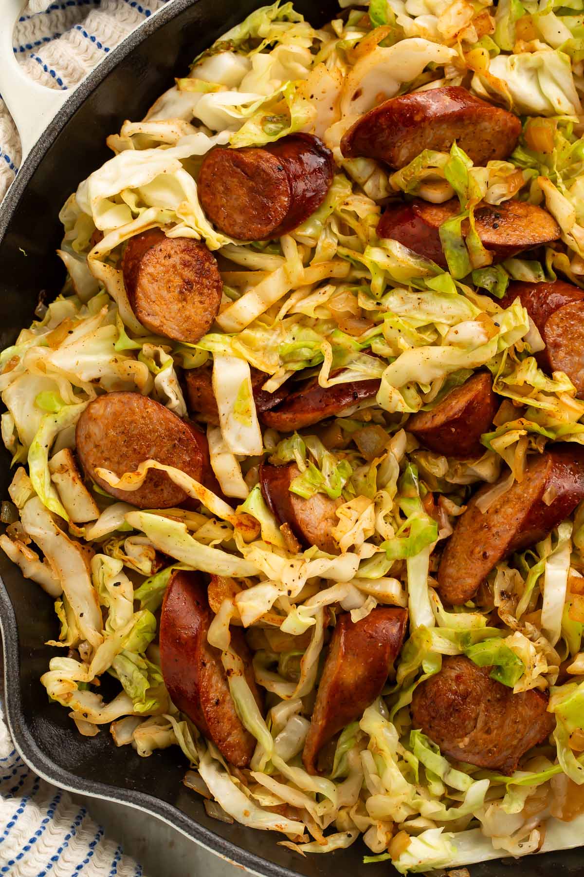 Kielbasa and cabbage in a large skillet.