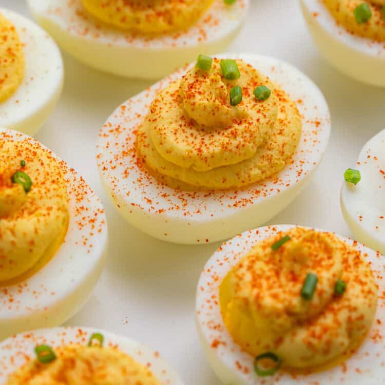 Close up of a white plate of classic deviled eggs.
