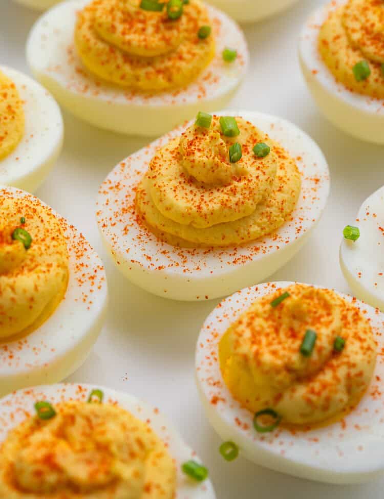 Close up of a white plate of classic deviled eggs.