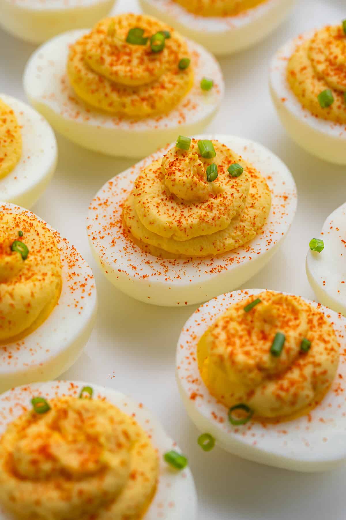 Close up of a white plate of classic deviled eggs.