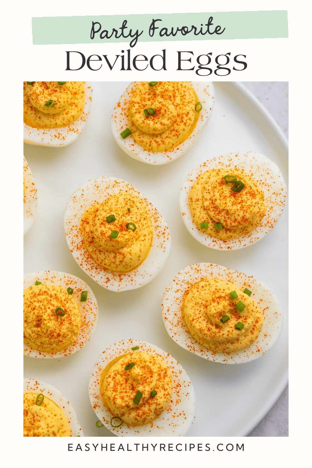 White plate of classic deviled eggs with a green and white Pinterest-optimised overlay.