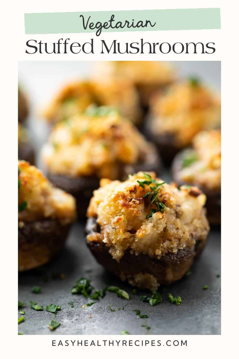 Side on close up of a breadcrumb topped stuffed mushroom. There is a white frame on the image with a Pinterest-optimised text overlay.