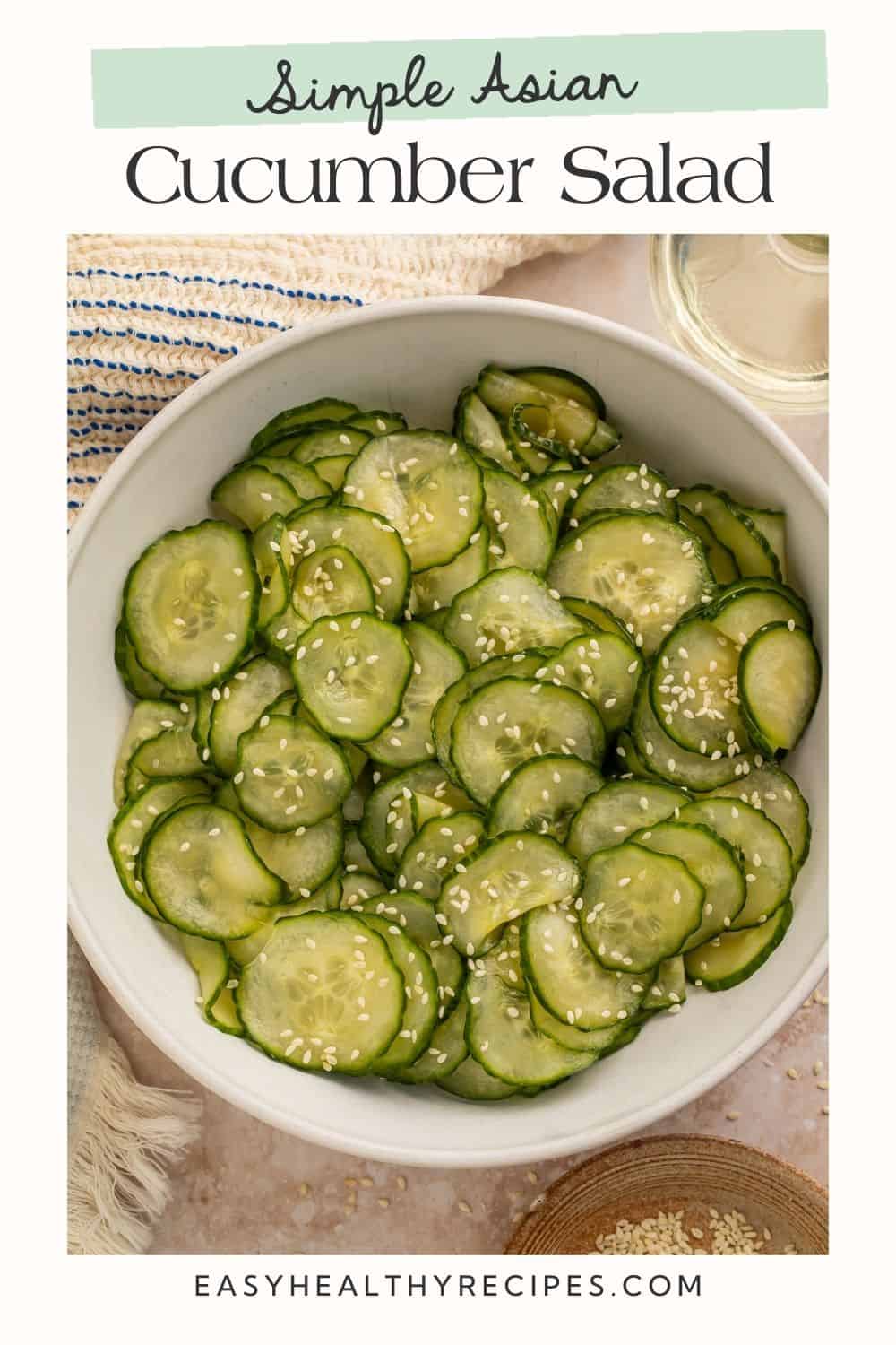 White bowl of Asian Cucumber Salad with Pinterest-optimised text overlay.