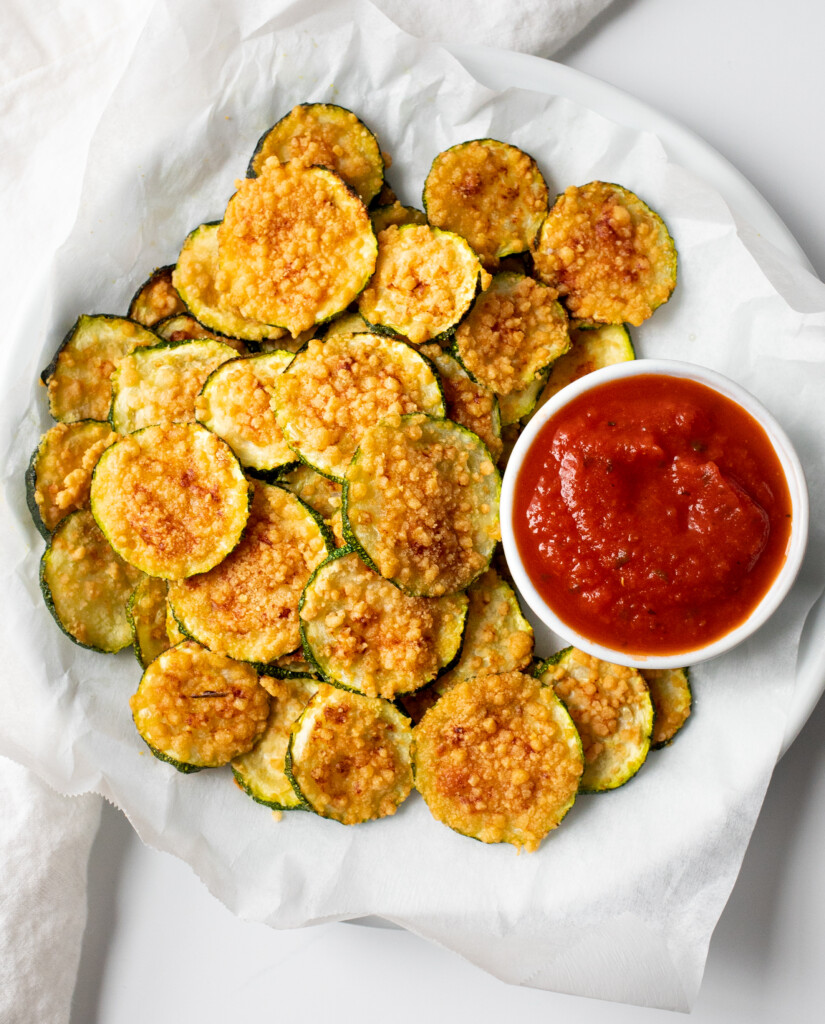 Air fryer zucchini chips on a white plate