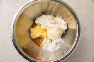 Ingredients for cream cheese fat bombs in a silver bowl