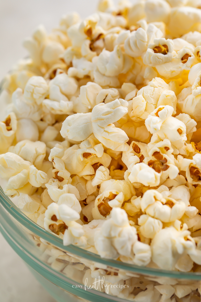 Close-up of air fryer popcorn in a glass bowl