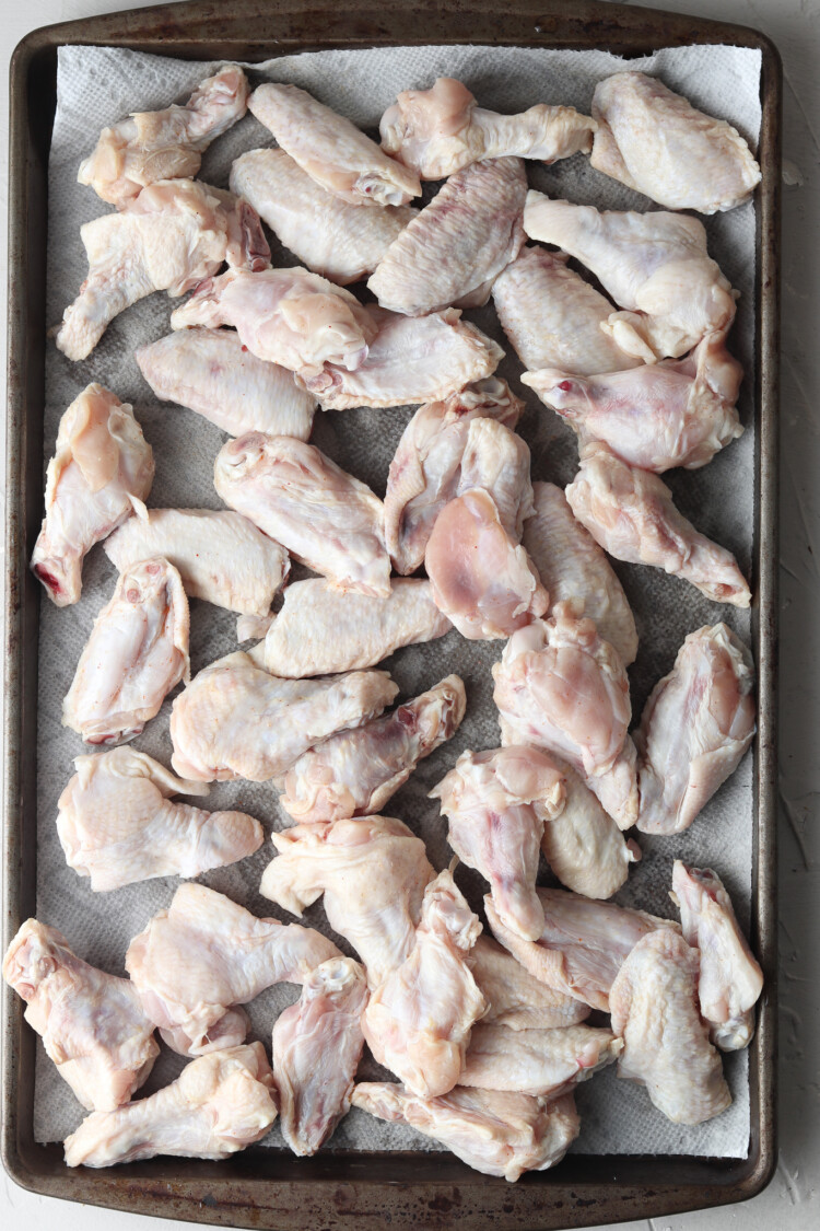 Chicken wings on a baking sheet.