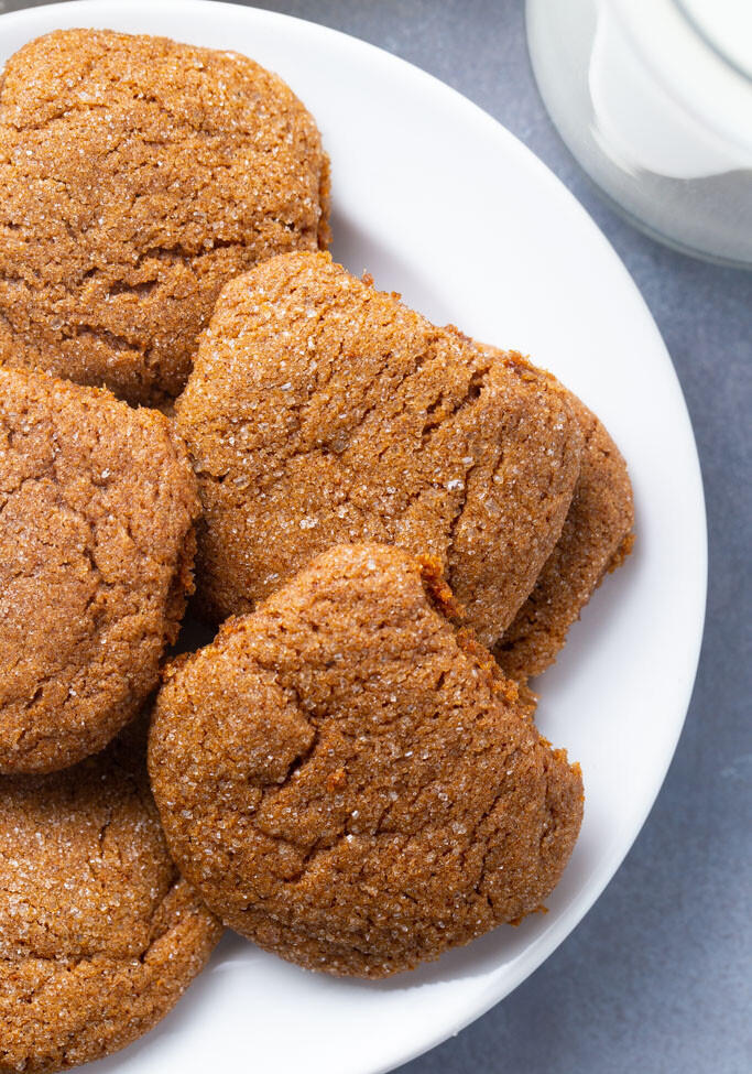 A white plate of 5 gluten free ginger snap cookies