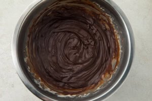 Melted chocolate in a large silver saucepan