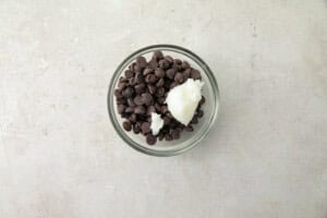 Small glass bowl with chocolate chips and coconut oil