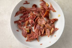 Smoked turkey meat on a white plate