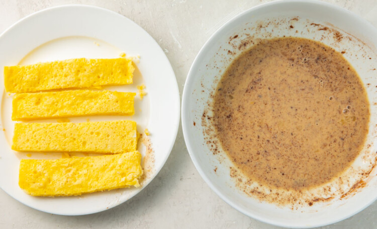 Plate of keto french toast sticks next to bowl of cinnamon-egg wash