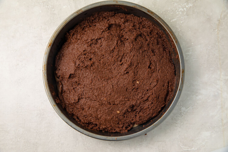 Chocolate cake in a silver round cake pan