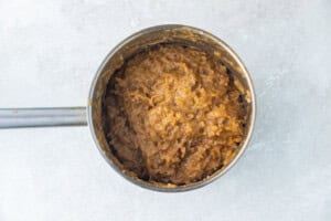German chocolate cake frosting in a silver saucepan