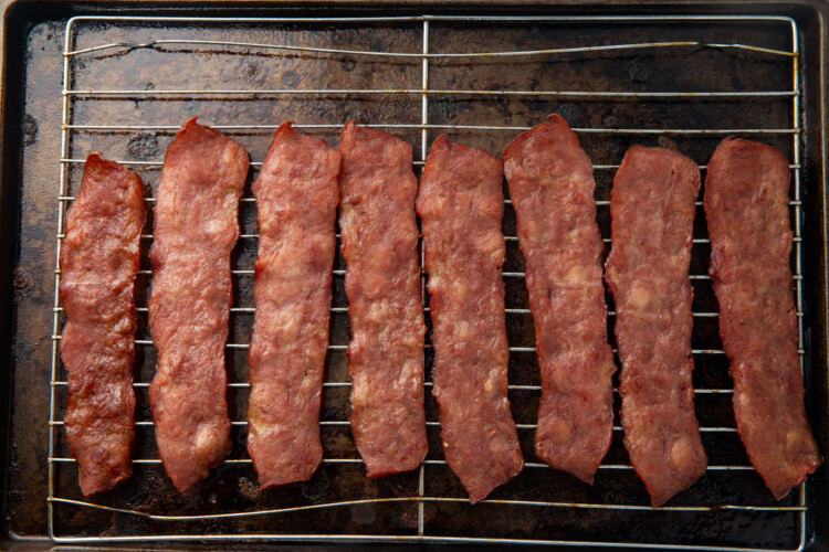 Cooked turkey bacon on a baking rack