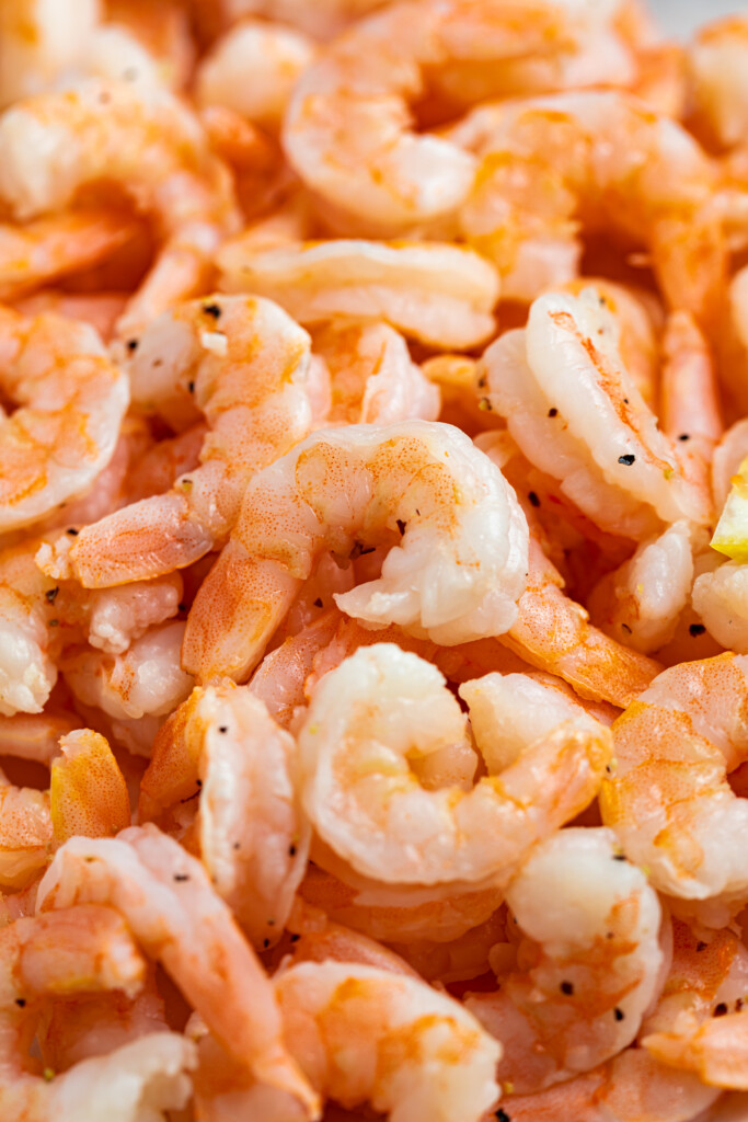 Close up image of a pile of cooked shrimp.