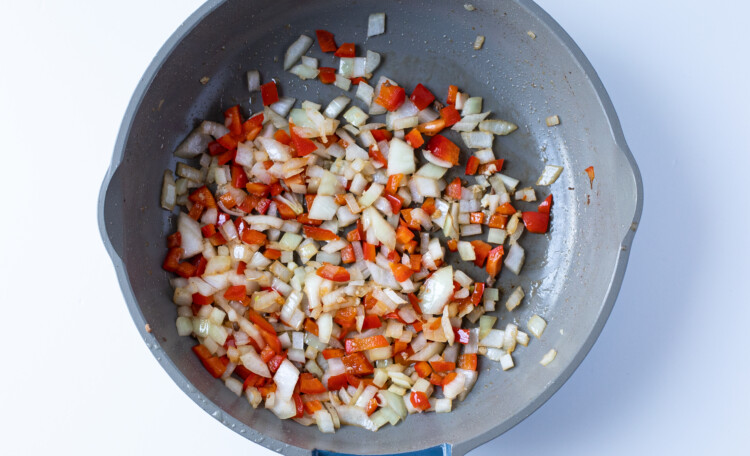 Onion, bell pepper, and garlic in skillet