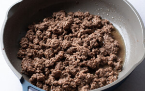 Crumbled ground beef in a large skillet