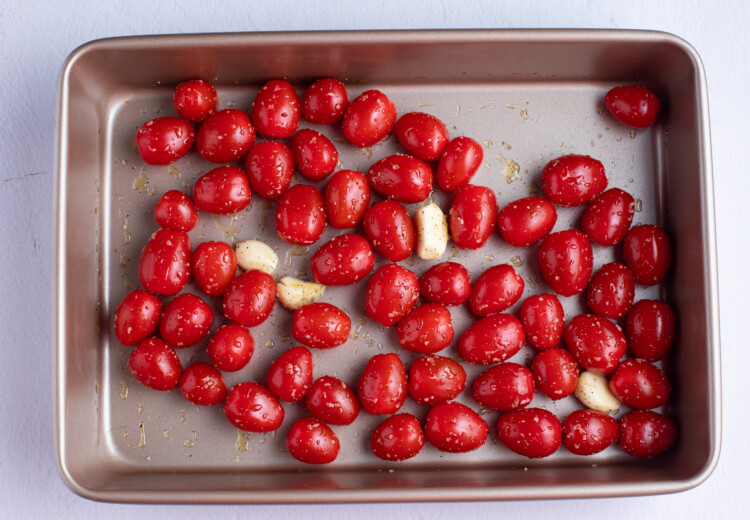 Grape tomatoes and garlic in a baking dish