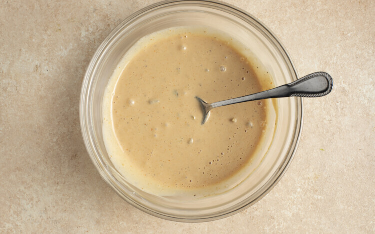 Burger sauce in glass bowl with spoon