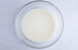 Wet ingredients for vegan coffee cake in large glass bowl