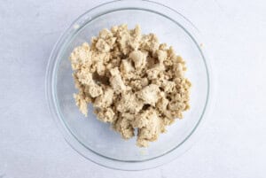 Streusel topping mixture for vegan coffee cake in large glass bowl