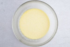 Wet ingredients for Instant Pot cornbread in a large glass bowl