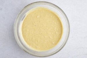 Instant Pot cornbread batter in a large glass mixing bowl