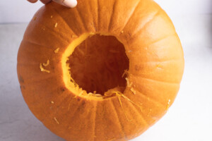 Hole cut into bottom of pumpkin