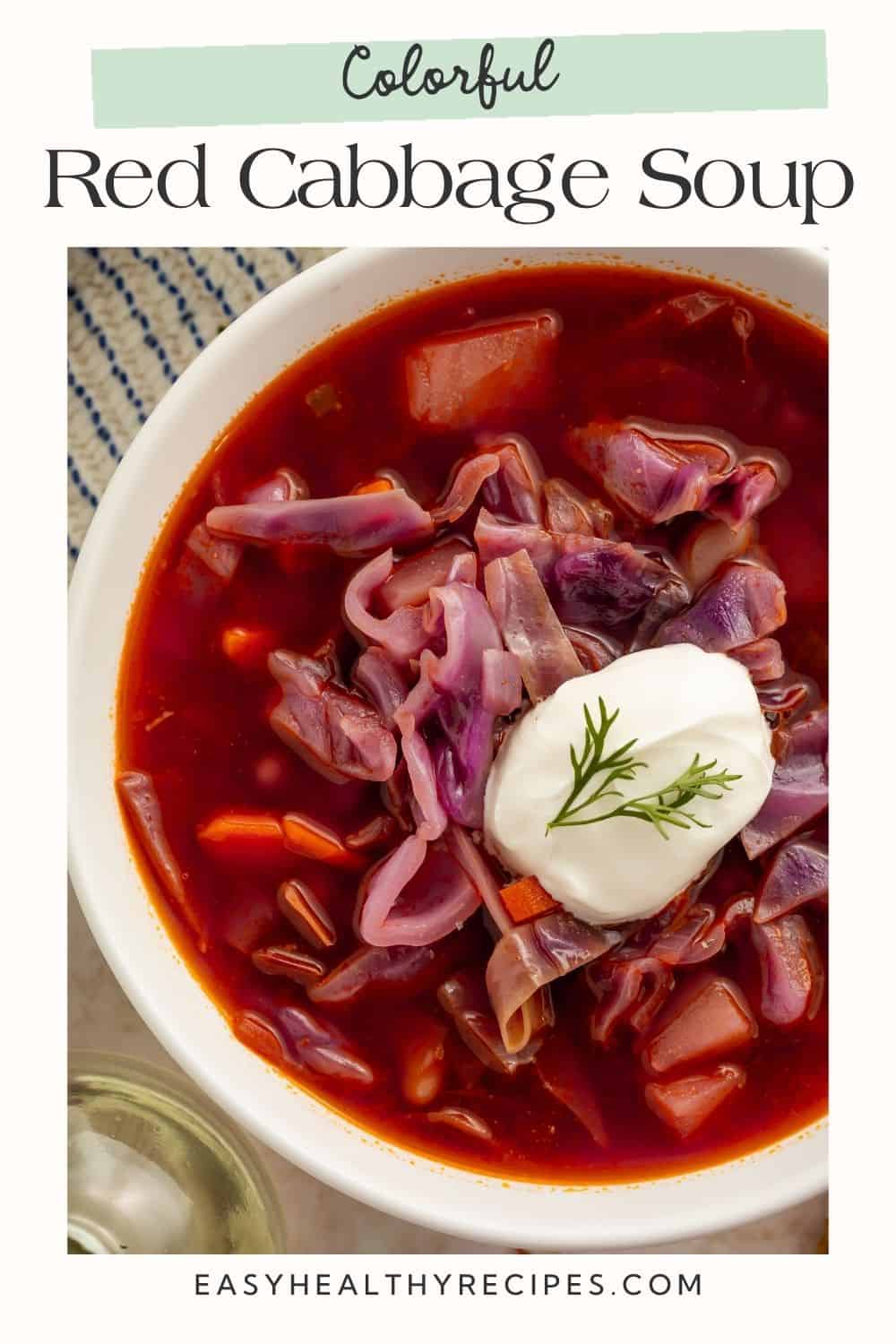 Bowl of red cabbage soup topped with sour cream and dill with Pinterest-friendly overlaid text.