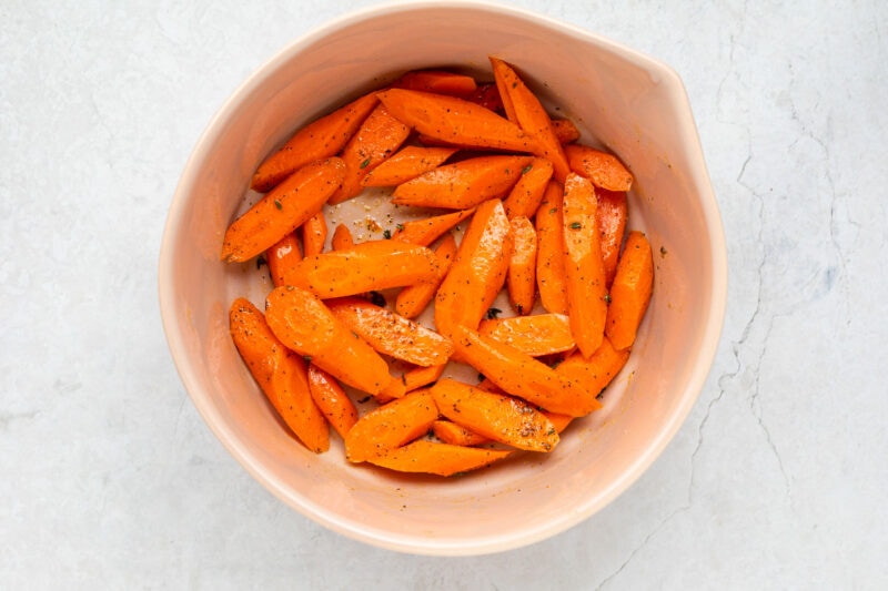 Sliced carrots in a large bowl.