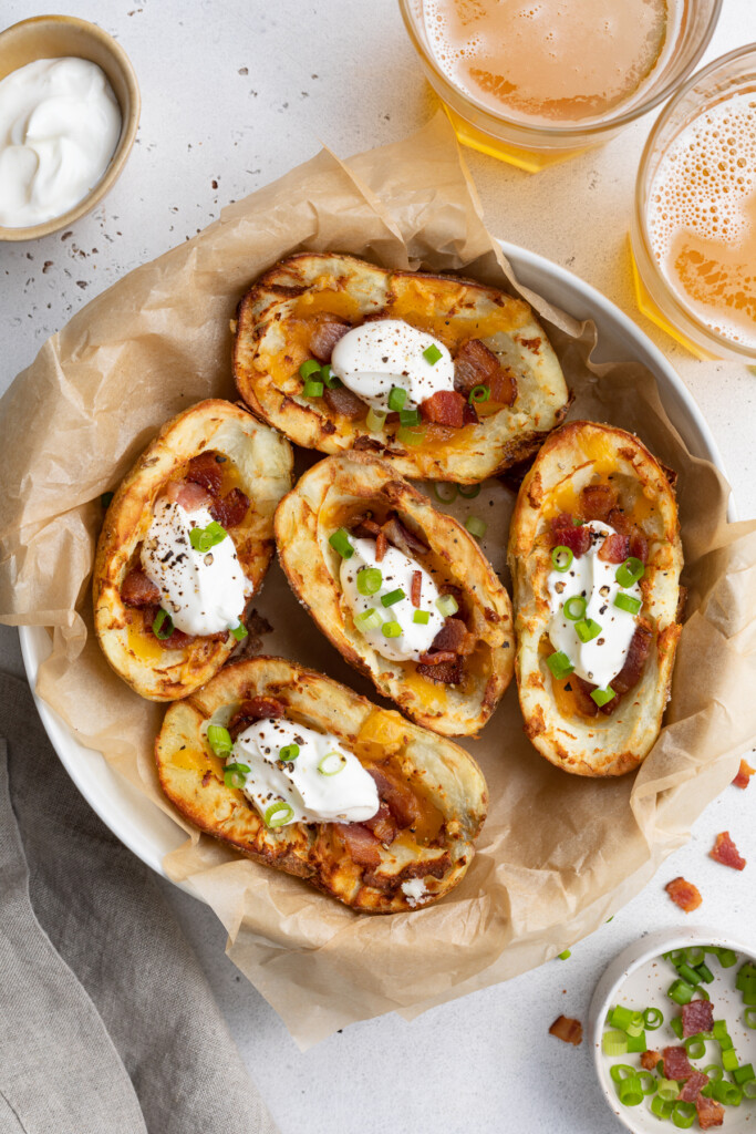 air fryer potato skins on a place with beer on the side