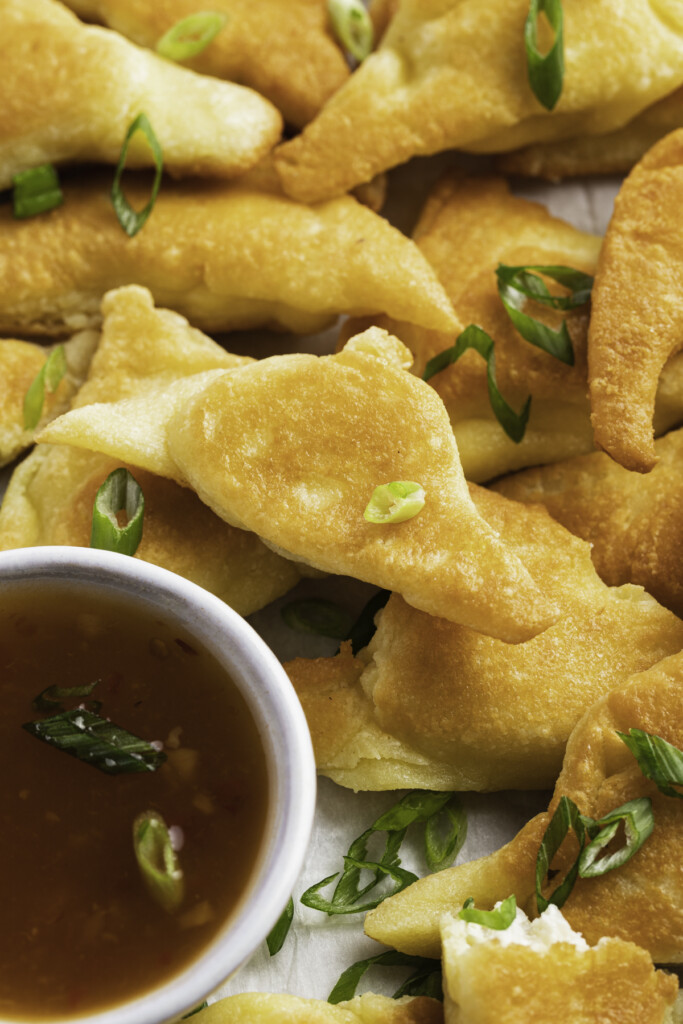 Keto crab rangoon on a plate with apricot preserves