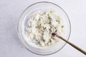 Crab rangoon filling in large glass mixing bowl