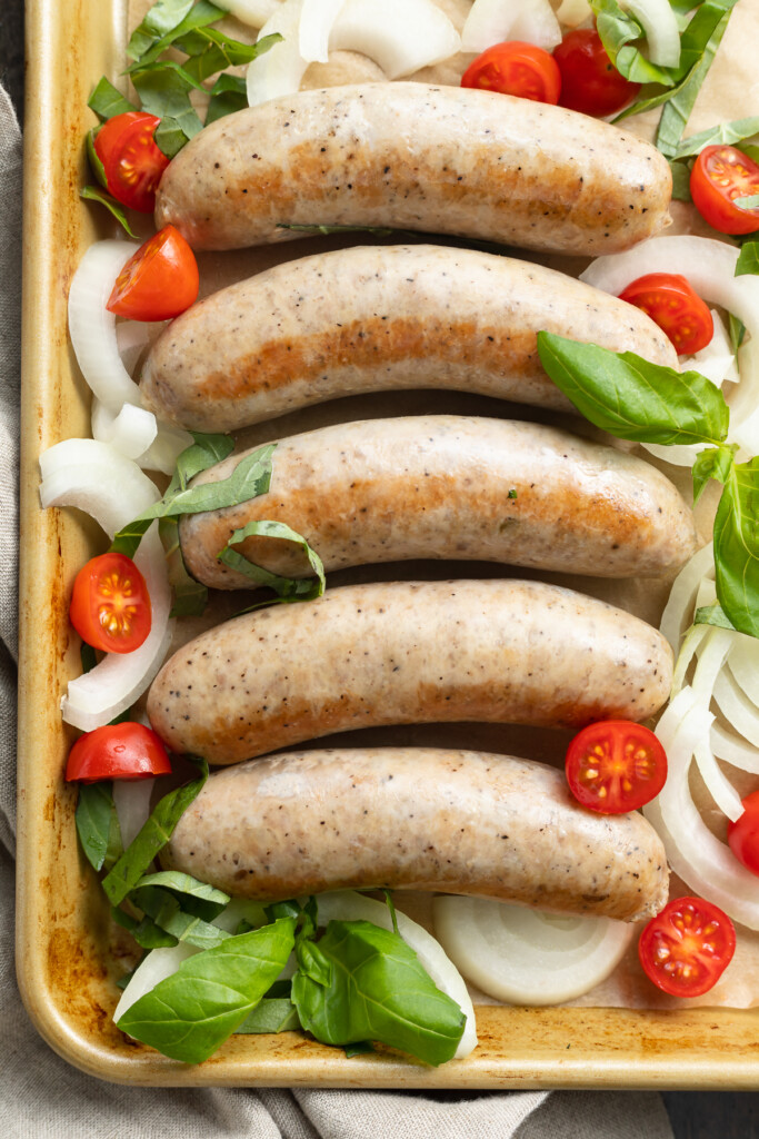 overhead image of instant pot italian sausage on a baking sheet