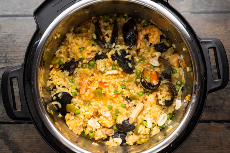 Overhead view of paella ingredients in an Instant Pot.