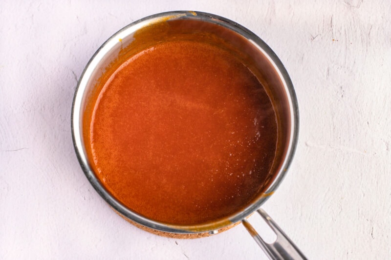 BBQ sauce in a silver saucepan.