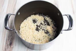 Rice, butter, and seasonings in a large saucepan.