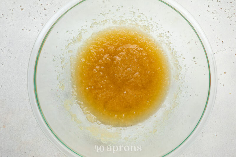 Wet ingredients for dairy free brownies in a large glass mixing bowl.