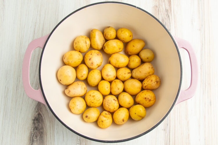 Baby potatoes in a large baking dish with high sides.
